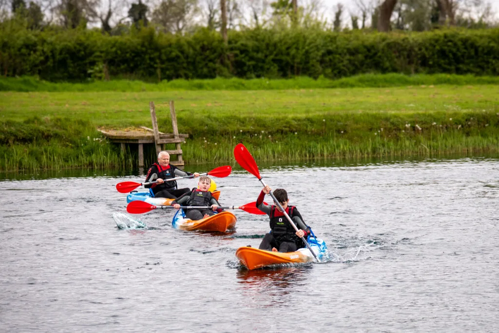 Kayakers paddling together on the lake at Moira Lakes